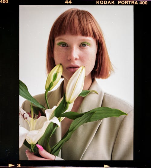 Woman with blooming fresh lilies in film frame