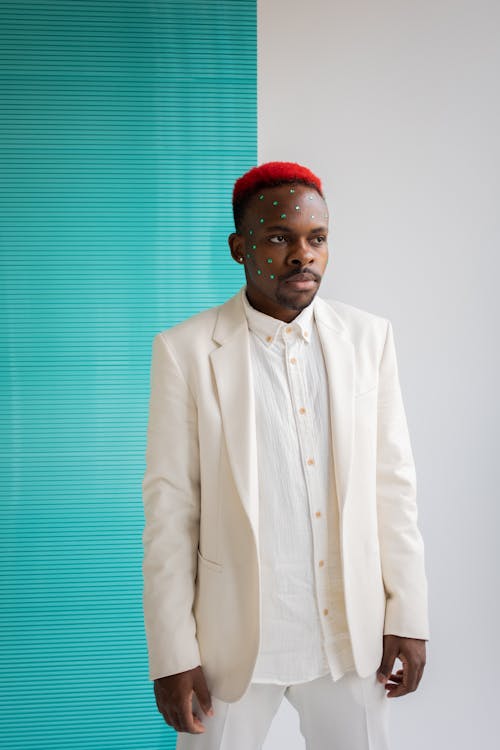 Trendy black man in white suit