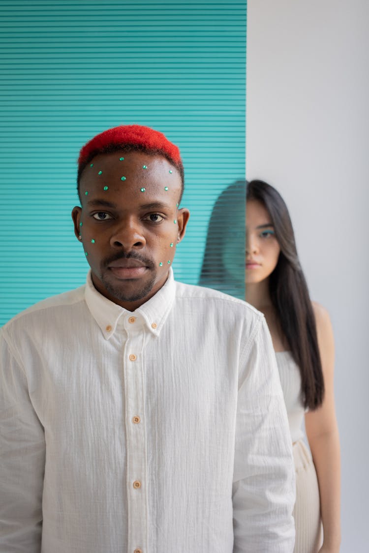 Multiethnic Man And Woman Looking At Camera