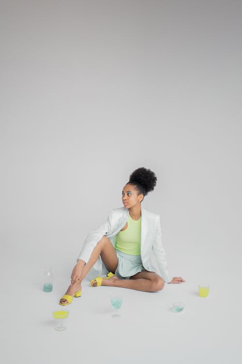 Young African American female sitting on floor