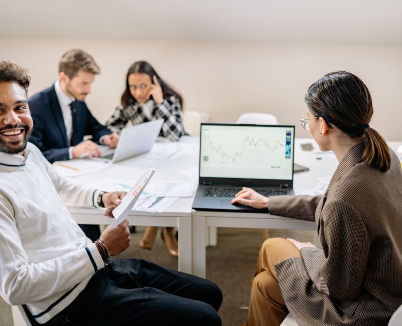 Sales team analyzing data metrics during a training session