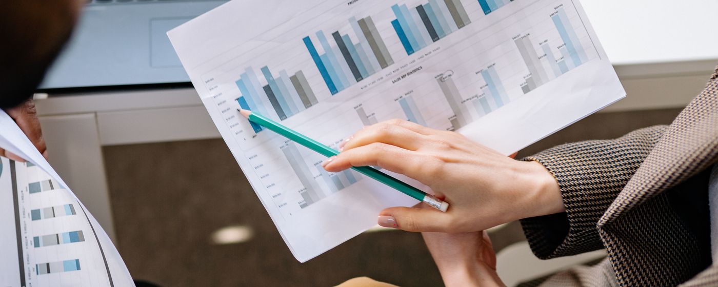 Two people discussing financial documents