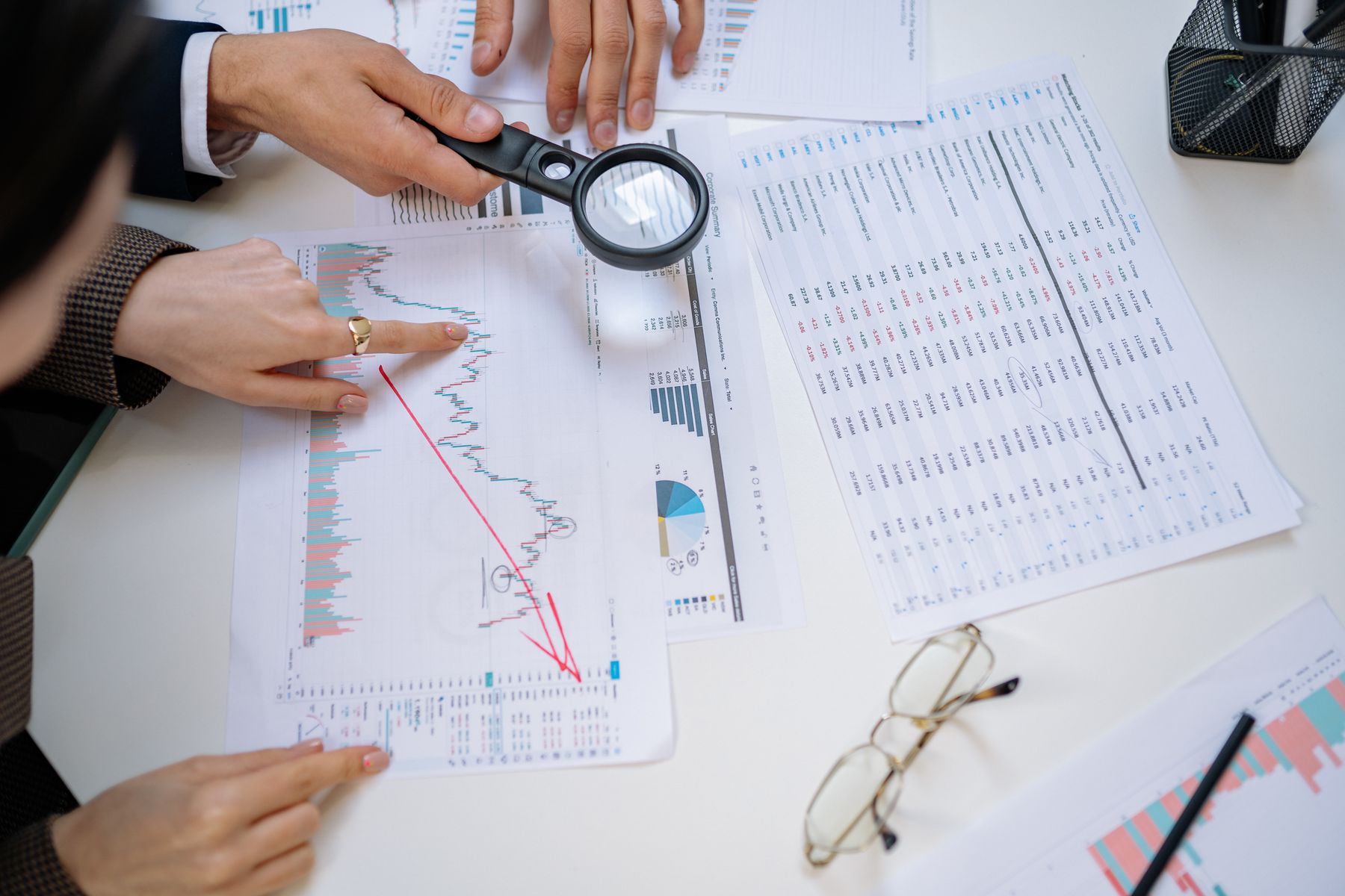 A team reviewing charts around a table