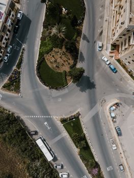 A bird's eye view of a roundabout in Il-Kalkara, Malta, featuring roads and greenery.