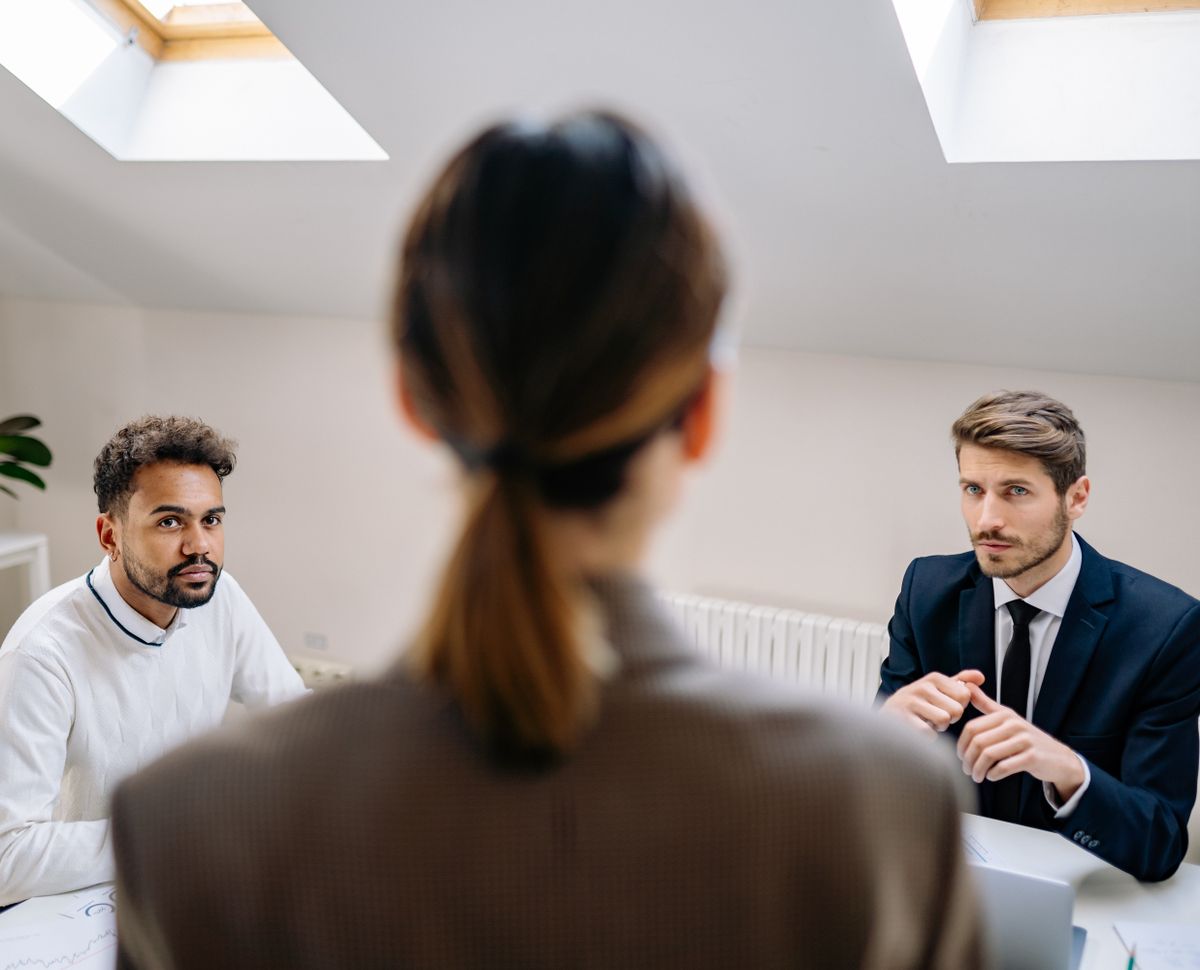 Business professionals discussing funding strategy and capital decisions