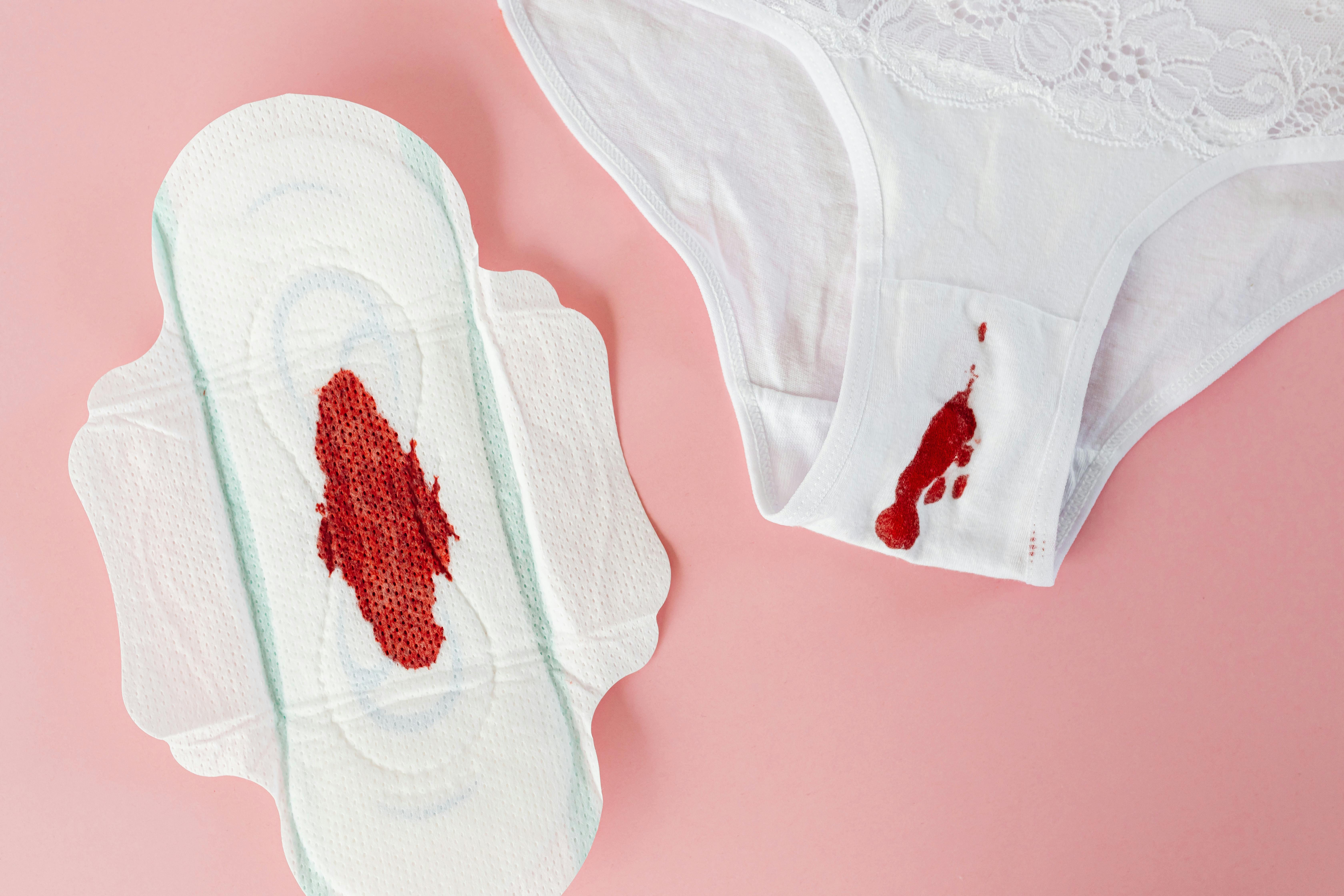 White panties in bloody stain. Beginning of the menstrual cycle. Signal of  the transition from girl to woman. Selective focus. by KYNA STUDIO. Photo  stock - StudioNow