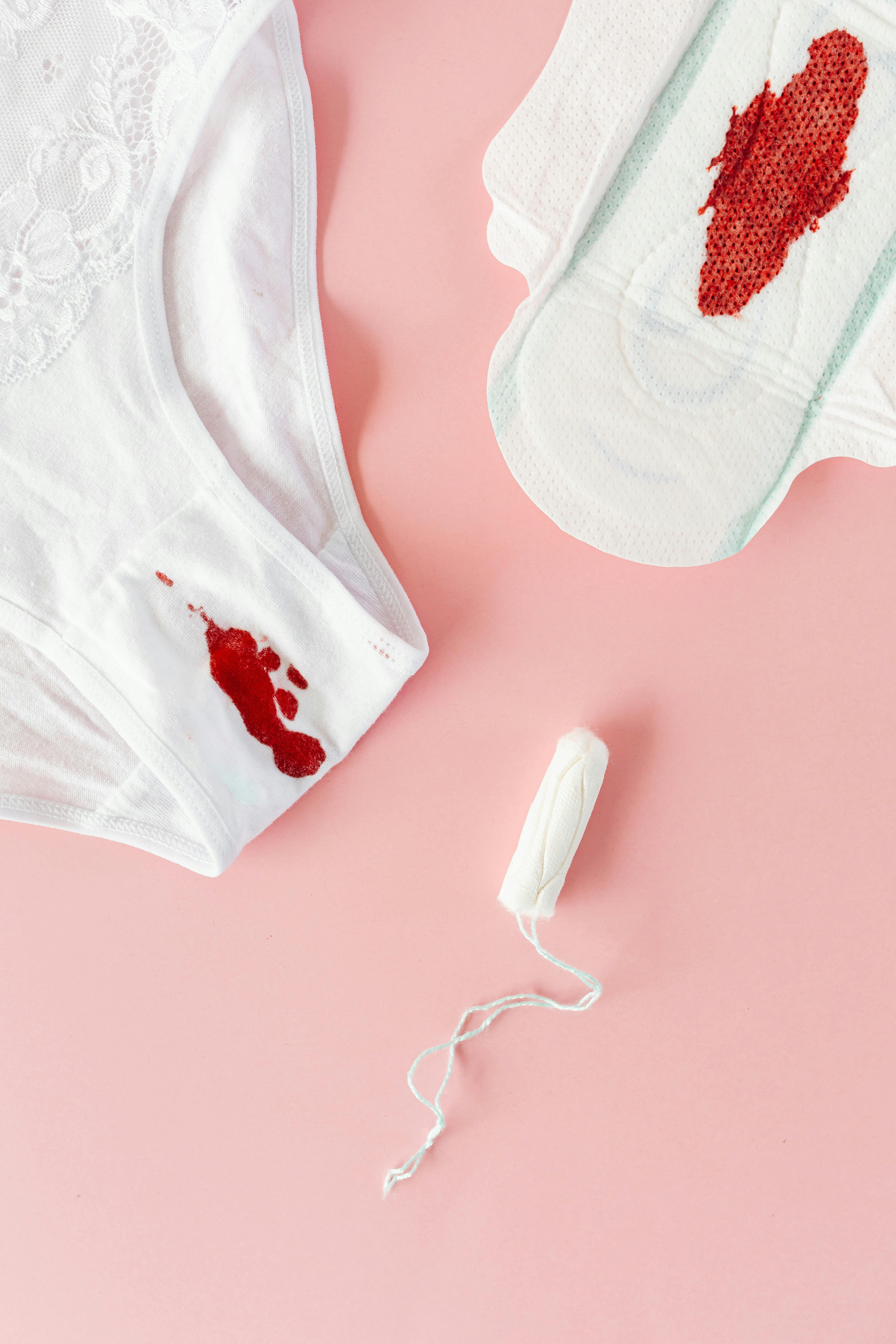 A Tampon beside an Underwear and a Napkin with Blood Stains · Free