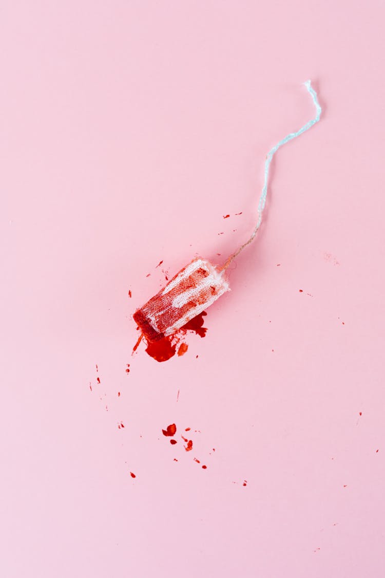 Flatlay Of A Tampon With Blood