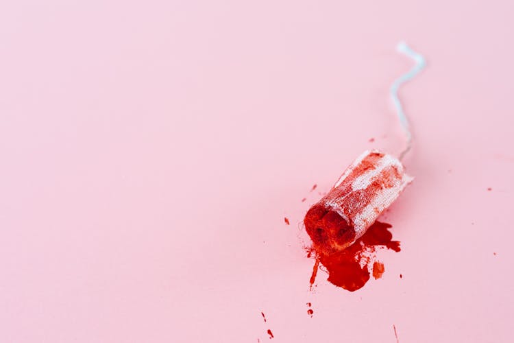 Close-up Shot Of A Tampon With Blood