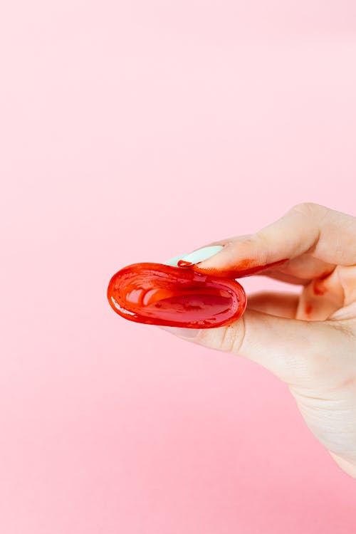 A Person Holding Menstrual Cup with Blood