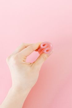 Person Holding Pink Heart Shaped Ornament