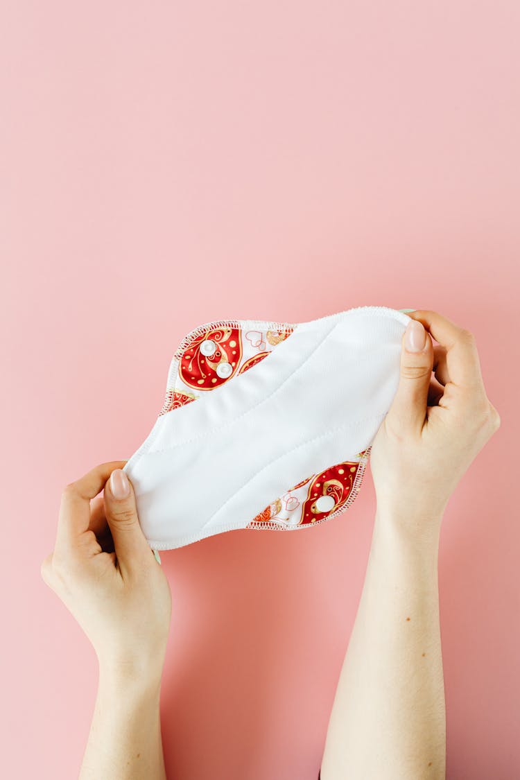 A Person Holding A Menstrual Pad 