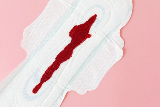 Detailed image of blood stain on a sanitary napkin symbolizing menstruation.