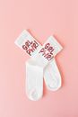 White Love Print Socks on Pink Surface