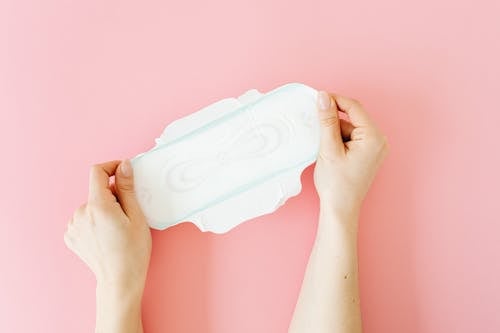 A Person Holding White Sanitary Napkin