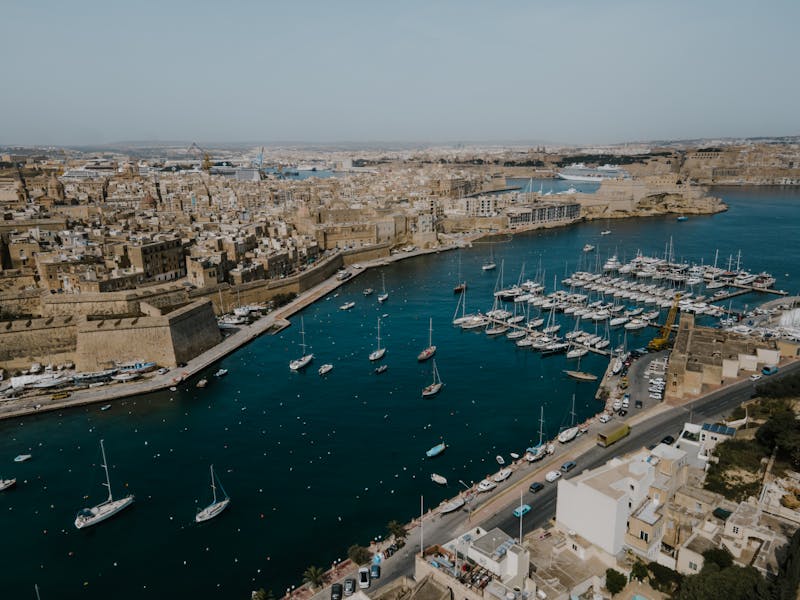 Aerial view of Kalkara and Valletta Grand Harbour showing historic fortifications and waterfront buildings