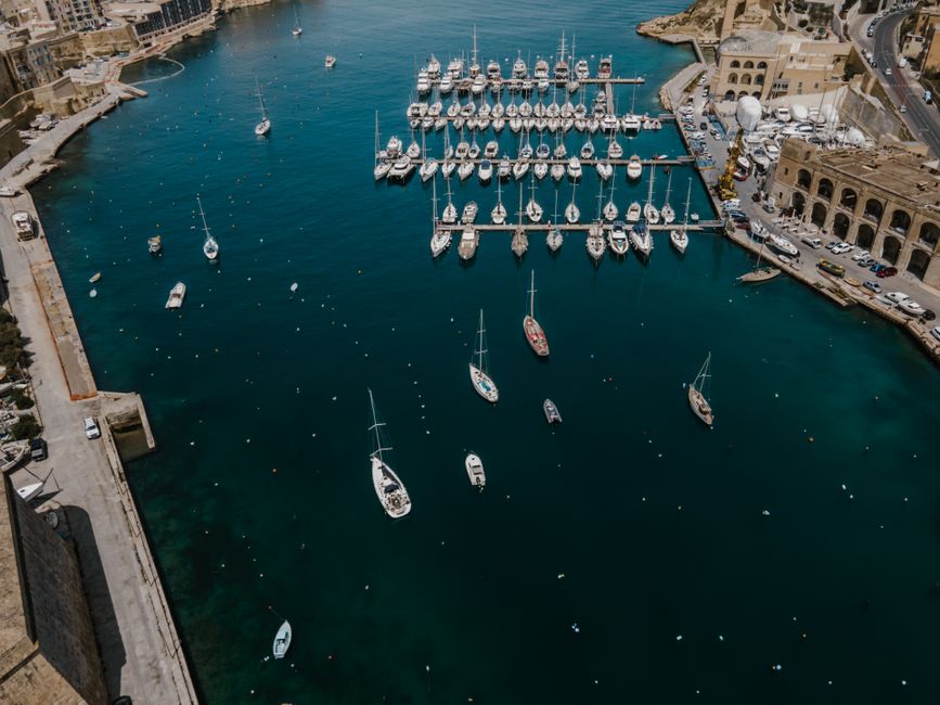 Spectacular Private Yacht Charter in Malta, Gozo & Comino - Full Day Review 2026 - Stunning aerial shot of Birgu Marina with yachts and boats docked in vibrant blue waters.