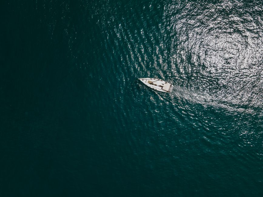 Stunning Private Yacht Charter Tour in Malta, Gozo and Comino - Half-Day Review 2026 - A yacht sails across the clear Mediterranean waters near Kalkara, Malta, captured from above.