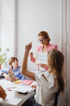 Teacher guiding students in a lively classroom with a focused learning atmosphere.