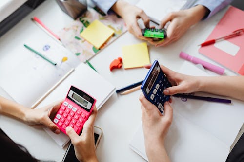 Three People Using Calculators