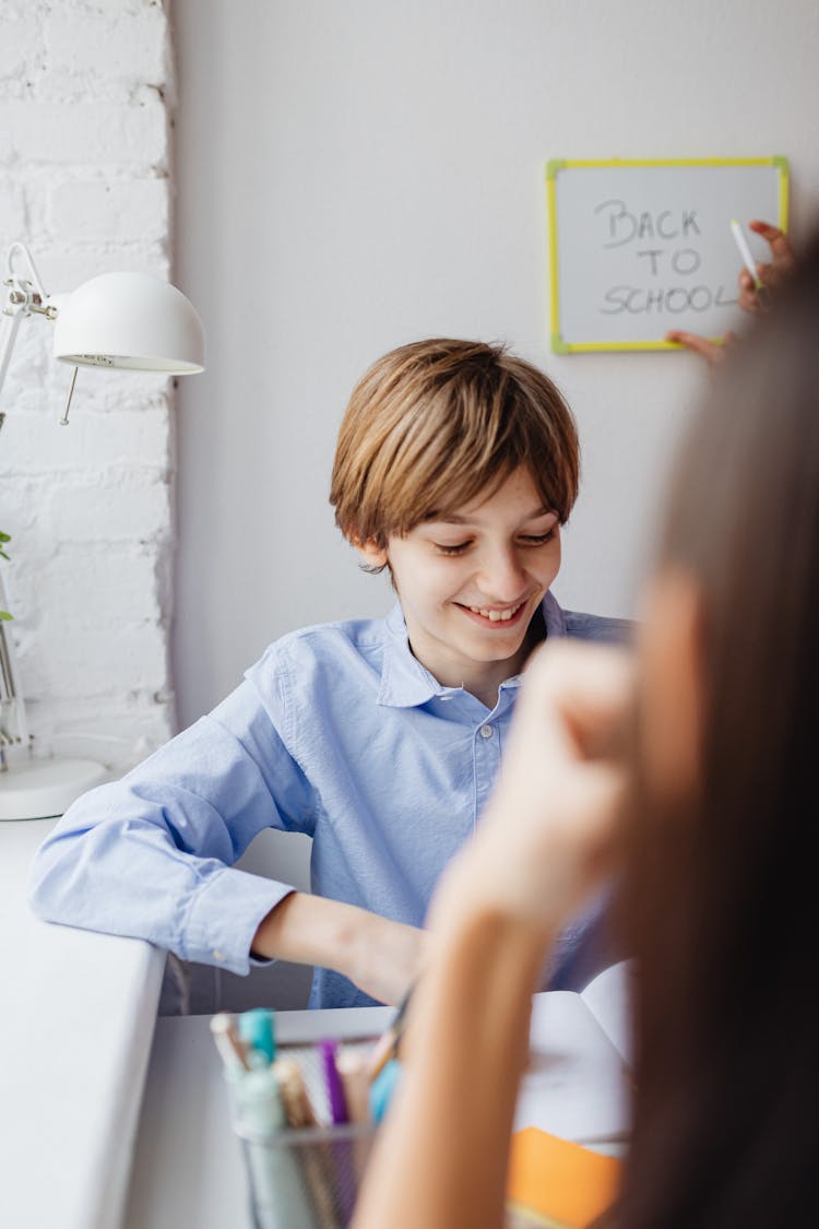 A Boy Studying In The School