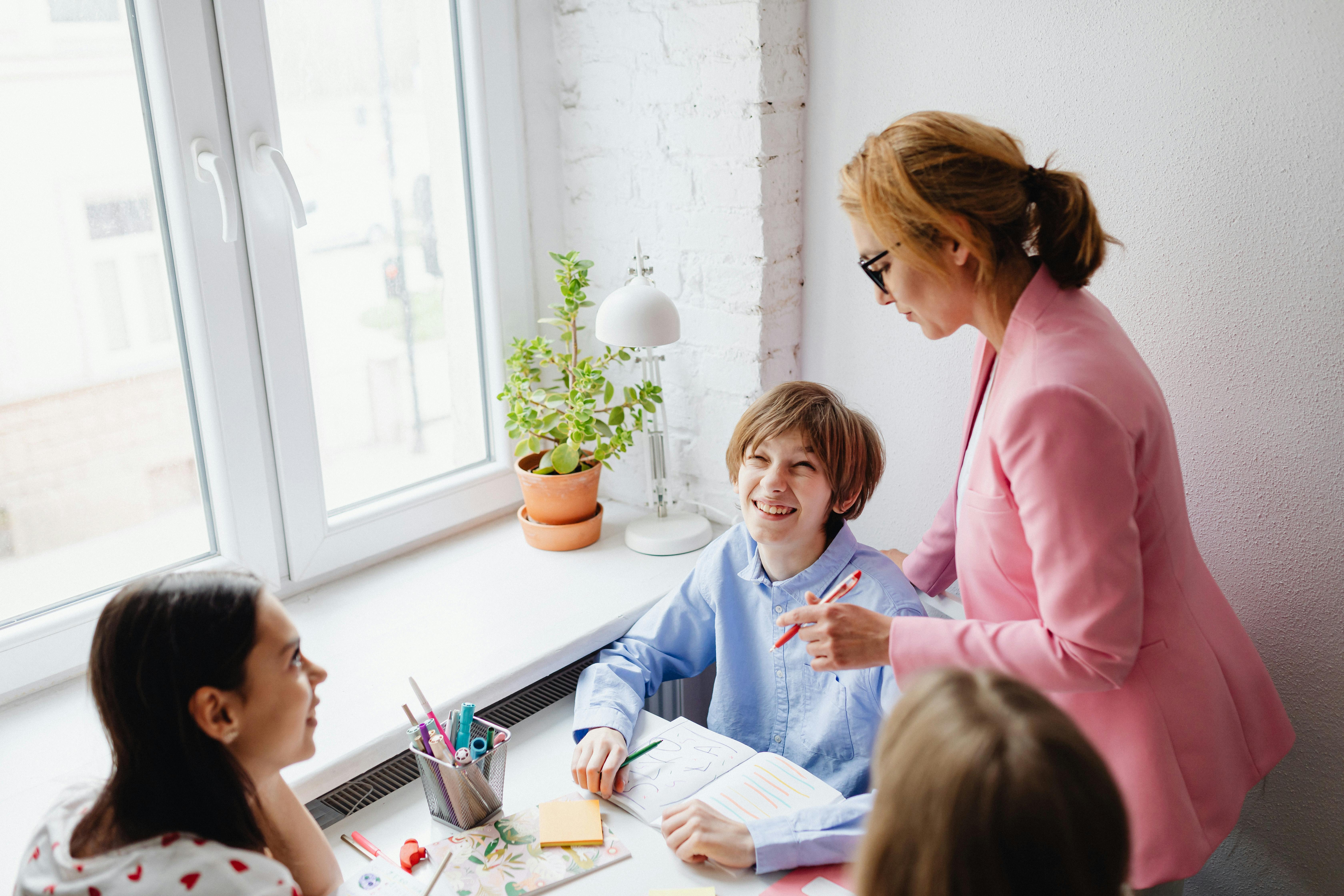 a woman teaching her students