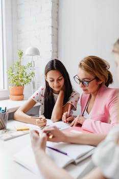 Teacher and students engaged in a creative school project indoors.