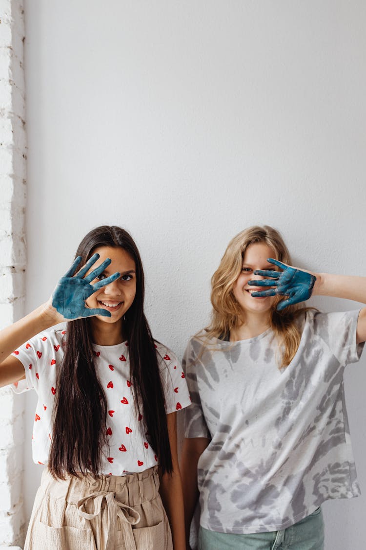 Smiling Girls With Paint On Hands