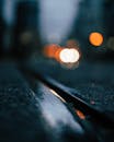 Bokeh Photography of Wet Road