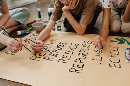 Students Painting on Brown Paper