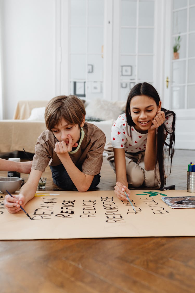 Girls Painting On Brown Paper