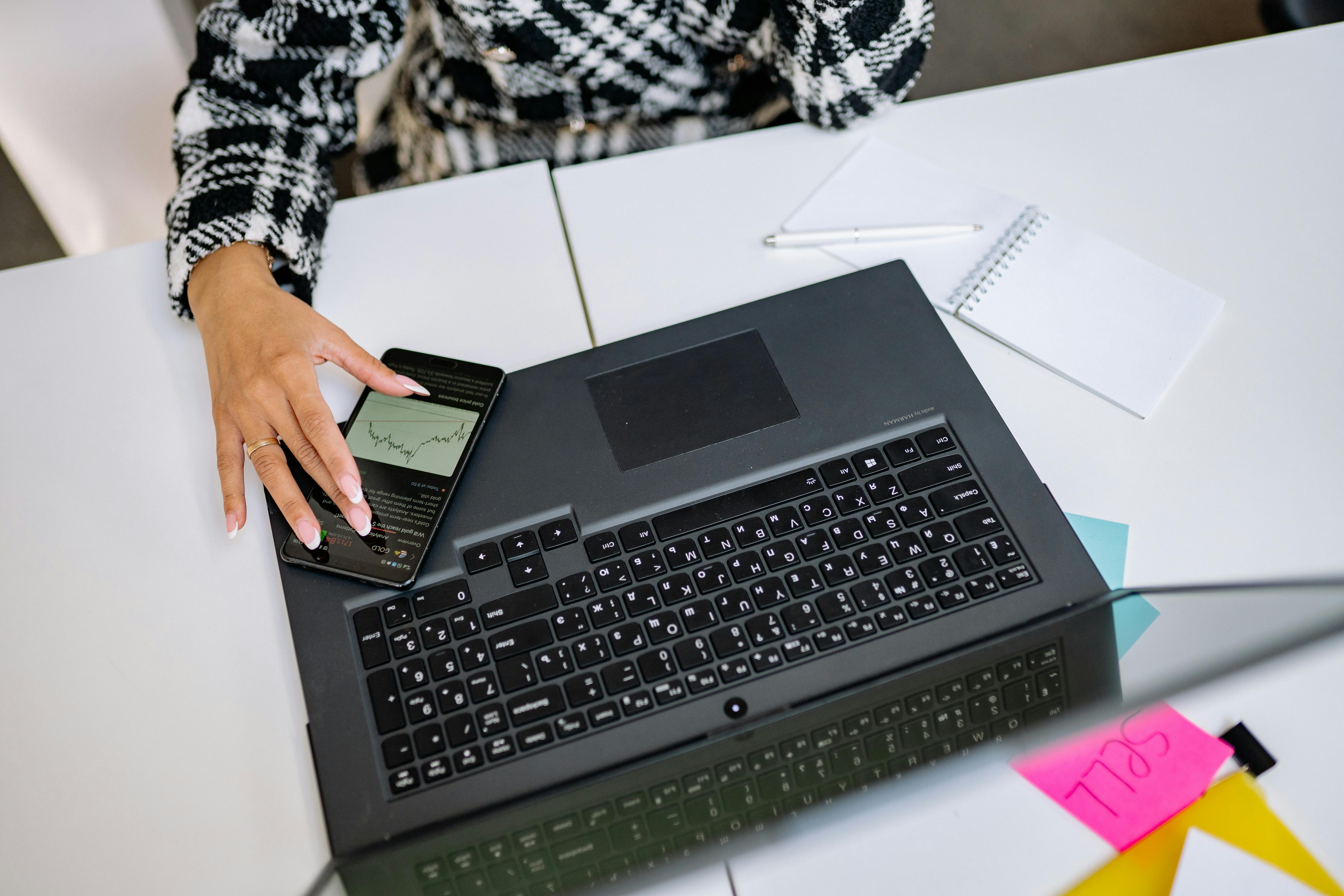Digital marketer comparing small business lead management and CRM software options on a laptop