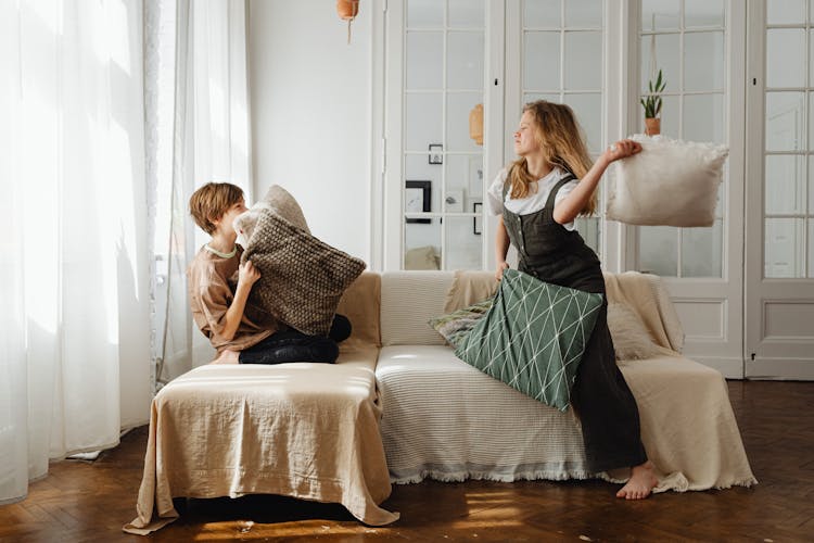 Teens Playing Pillow Fight