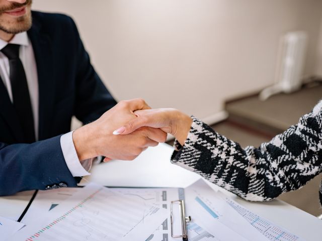 Business documents being reviewed and signed during order confirmation