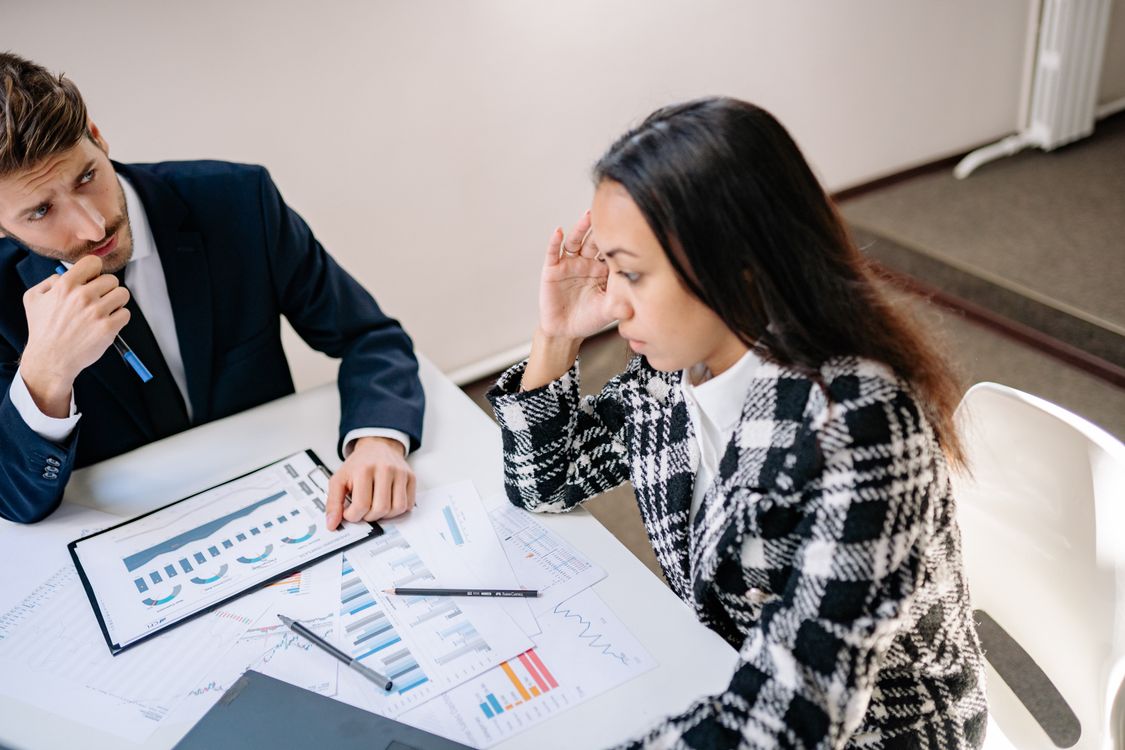 Man and Woman Sitting at the Table · Free Stock Photo