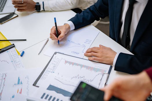 Professionals analyzing financial charts in a corporate setting.