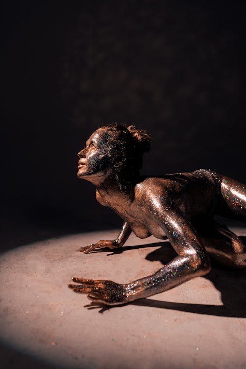 A Naked Woman with Glitters on Her Body