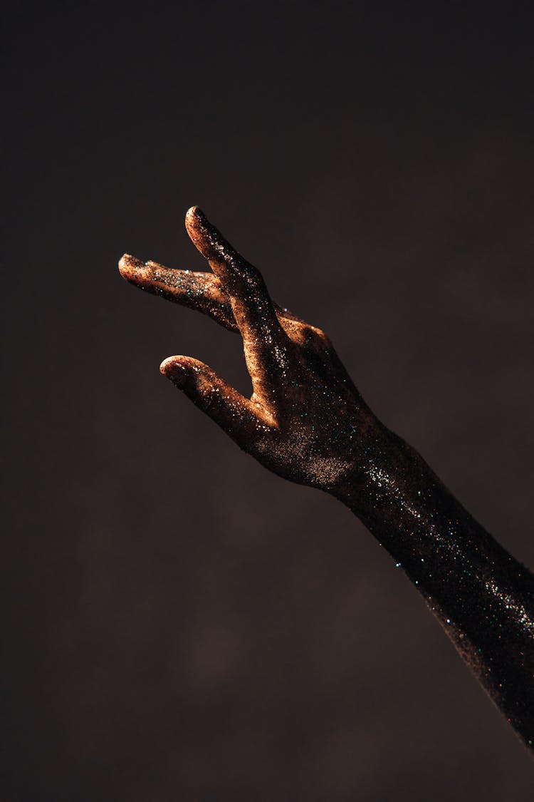 An Arm Covered With Glitters 