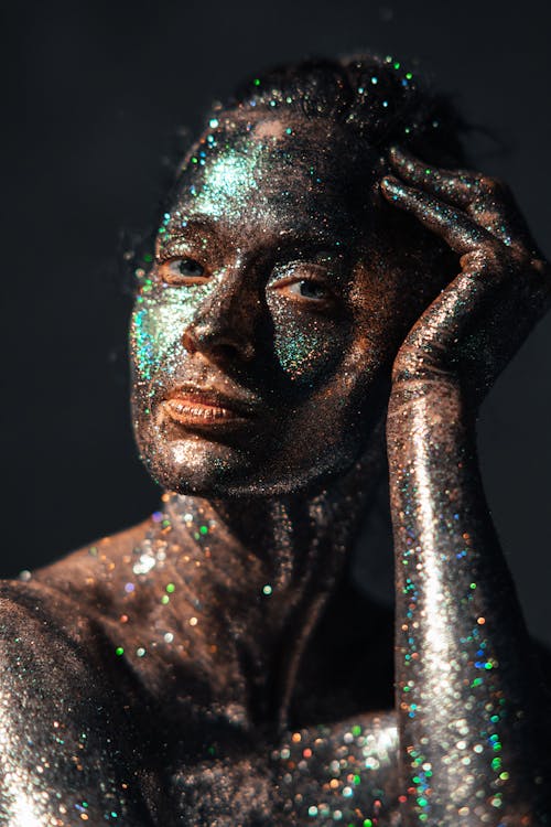 Person Covered with Black and Blue Glitters · Free Stock Photo