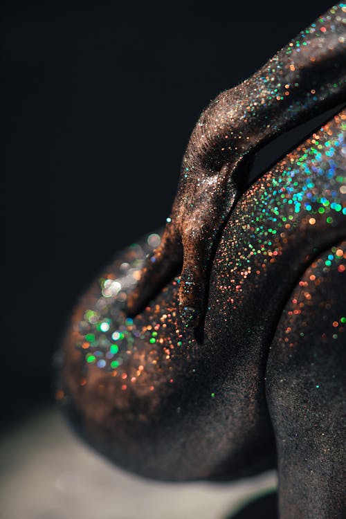 A Person's Body Covered with Glitters