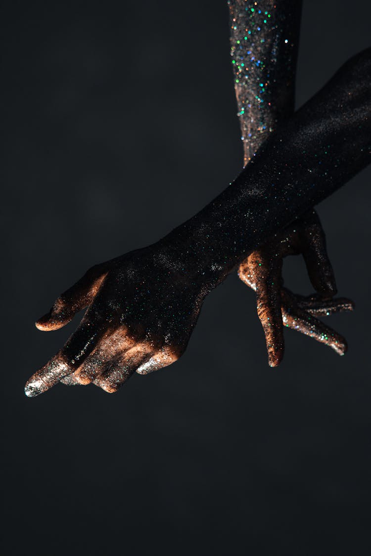 Glittery Body Art On Person's Hands And Arms