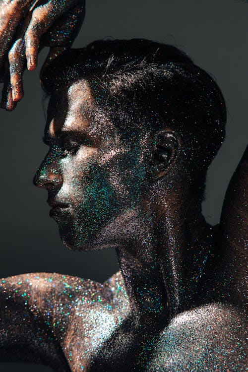 A Shirtless Man Covered with Glitters