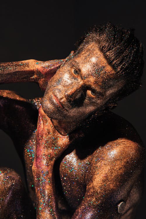 A Shirtless Man Covered with Glitters