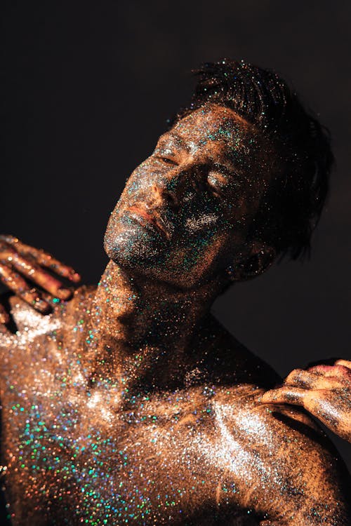 
A Shirtless Man Covered with Glitters