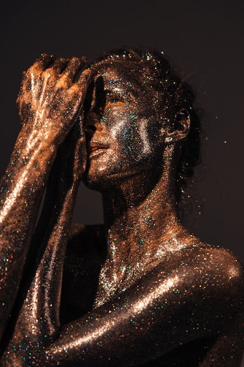 A Woman Covered with Grease and Glitters