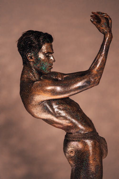 
A Naked Man Covered with Glitters