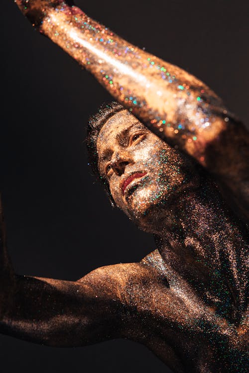 
A Shirtless Man Covered with Glitters