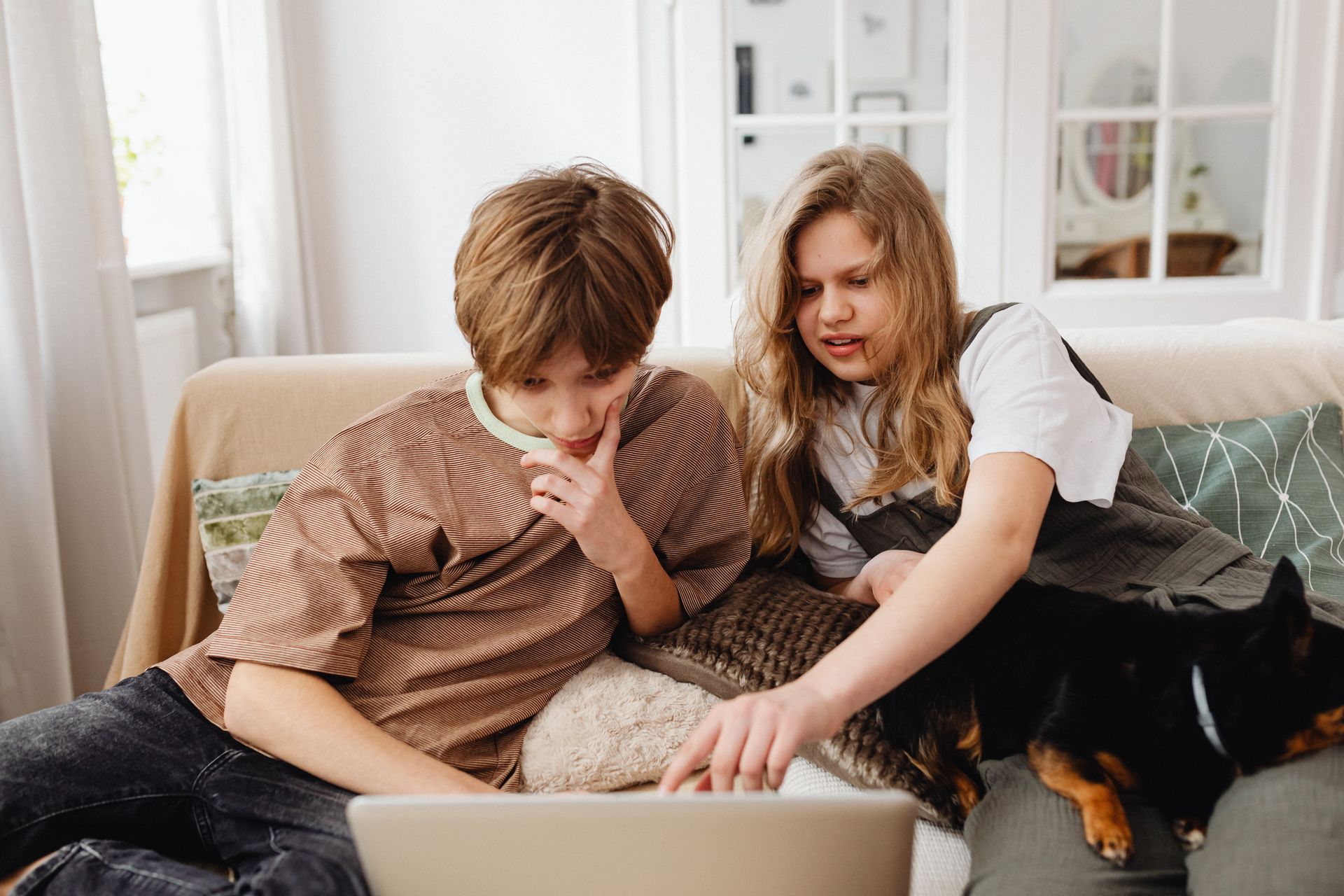 A Girl Pointer Her Finger on the Laptop Screen