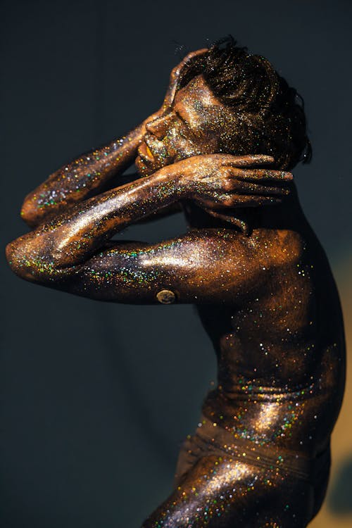 Free A Man Covered with Shimmering Body Paint Stock Photo
