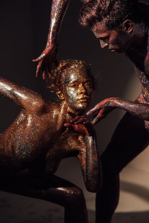 A Man and a Woman Covered with Shimmering Body Paint